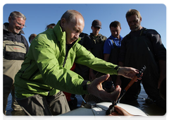 Vladimir Putin fixing components in place with precise movements