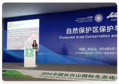 Leopard Land employee Yulia Burkova gives a talk at a Chinese environmental forum