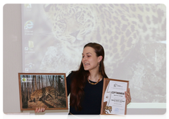 Valentina Pichugina, head of the environmental education department at Land of the Leopard, with a Leopard Keeper certificate