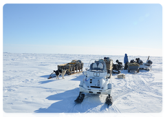 Expedition participants on the ice of Kolyma Bay of the East Siberian Sea