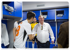 Sergei Ivanov talks to players before the match