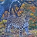 Дальневосточный леопард на фоне осеннего леса. Кадр с фотоловушки